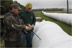 Doug Sr. and Douglas Carter puling hay samples